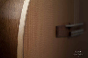 Walnut classical guitar body diagonal view